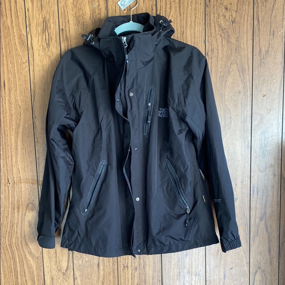 The North Face Black Raincoat with Hood and Weather-Resistant Fabric